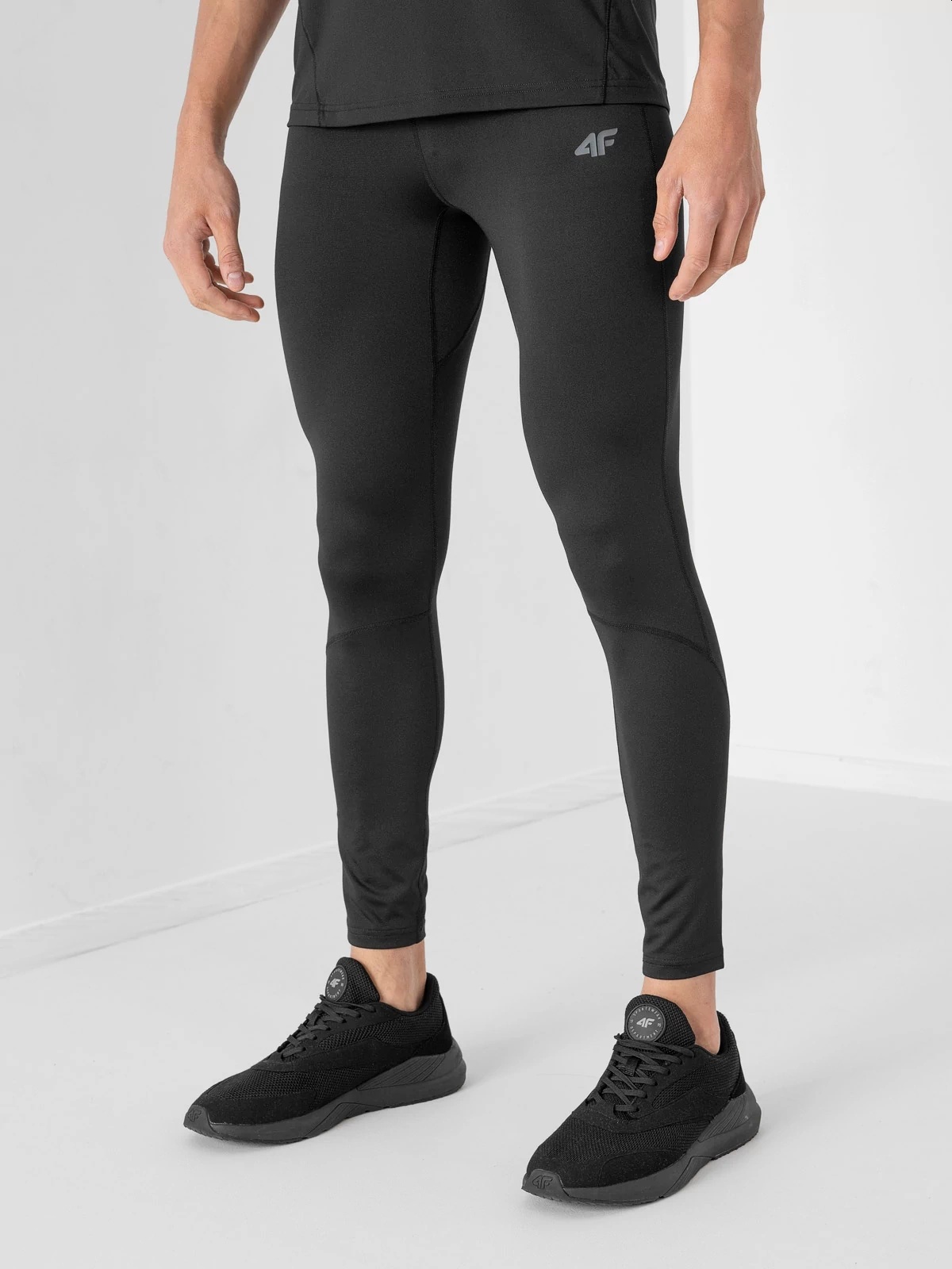 LEGGINSY TRENINGOWE SZYBKOSCHNĄCE MĘSKIE 4F BIEG L Materiał dominujący poliester