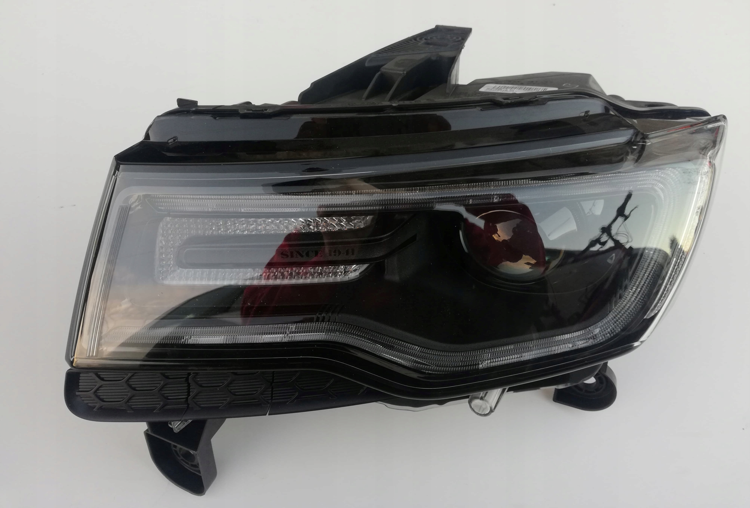 LAMPA XENON LEWA JEEP GRAND CHEROKEE 68111035AE