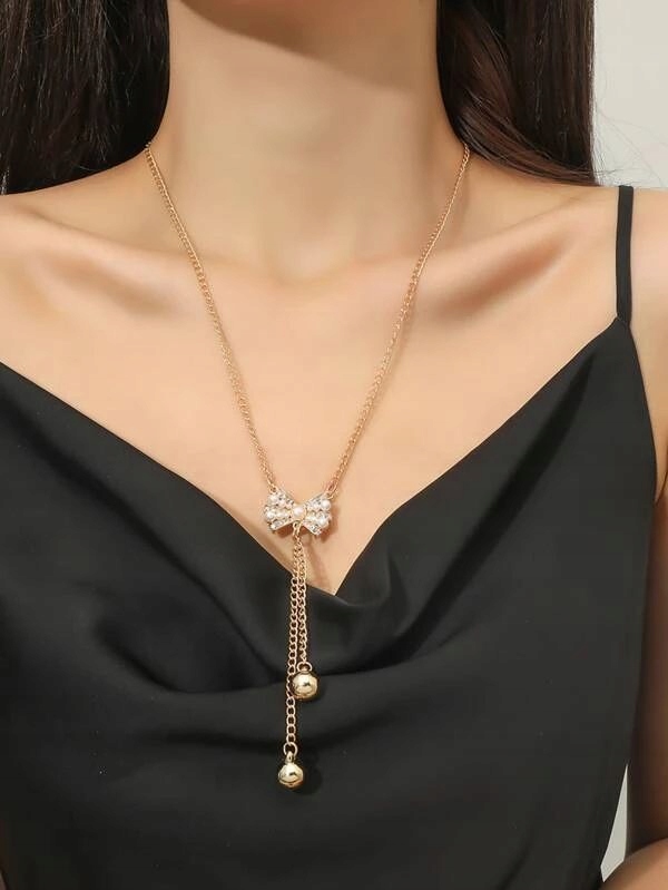 Naszyjnik długi przedłużany z kulkami z kokardą