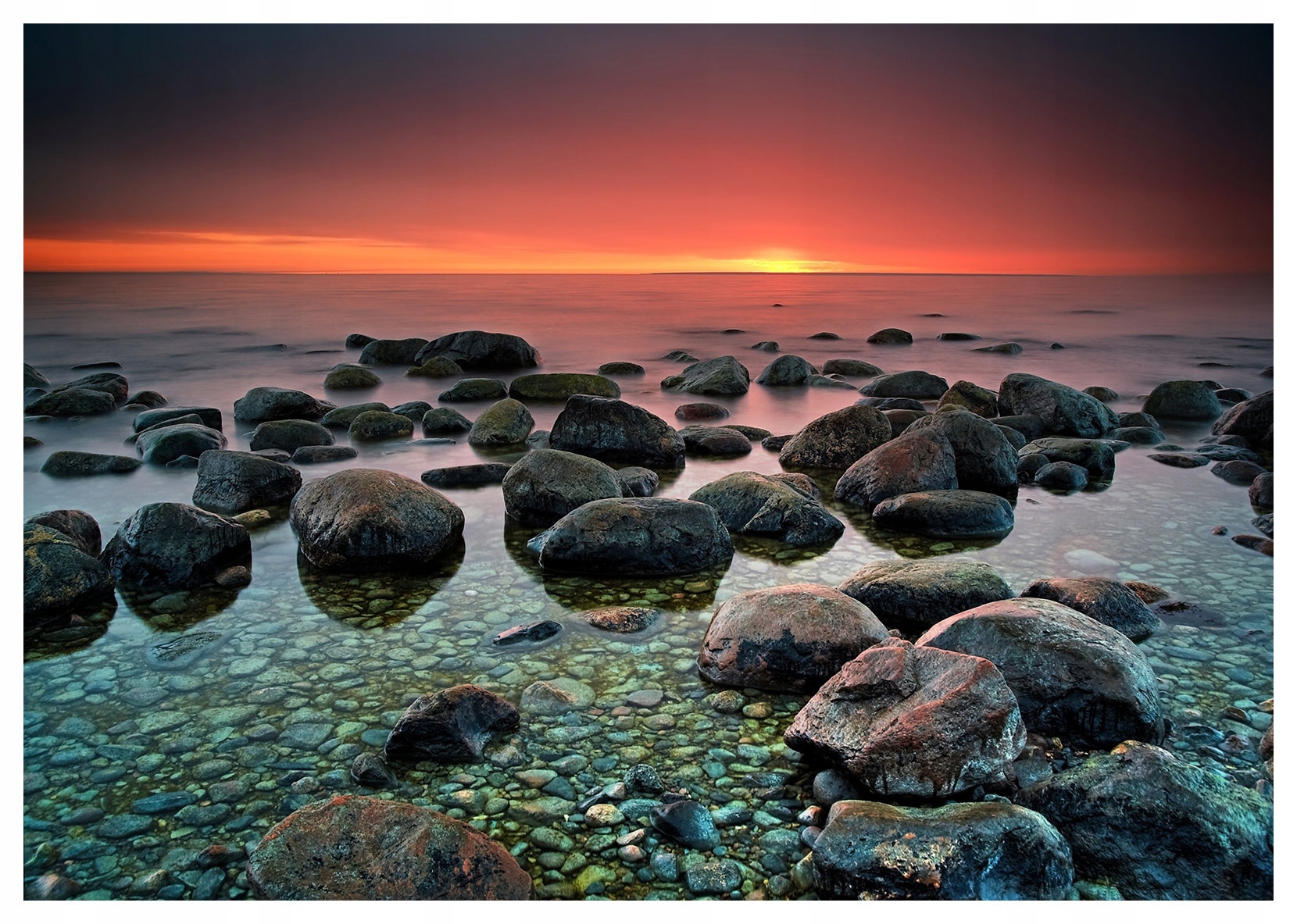 Vliesová fototapeta Západ slunce, kamenitý břeh, moře 350x250 lepidlo