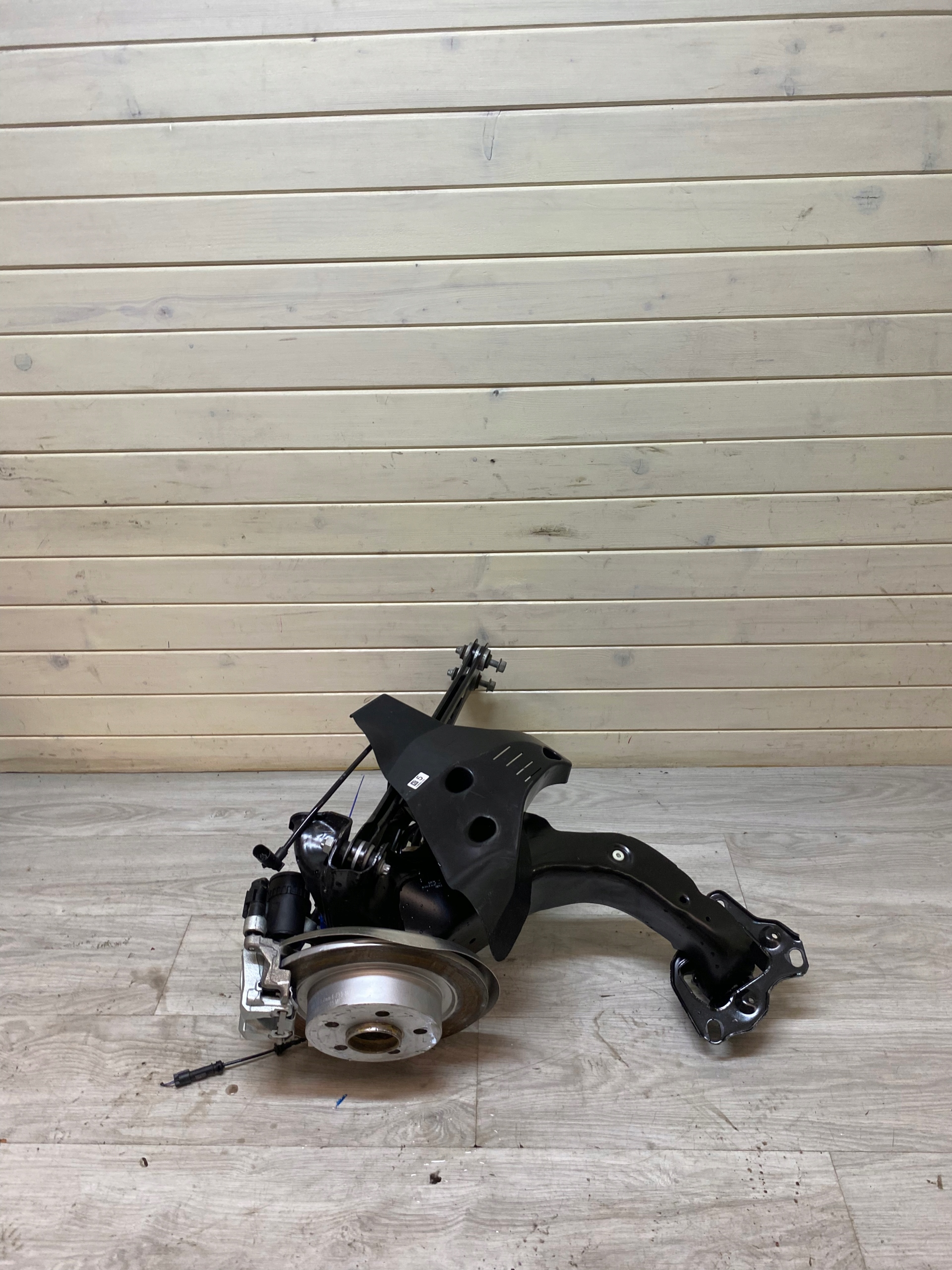 MINI F54 swing arm TARCZ left rear part