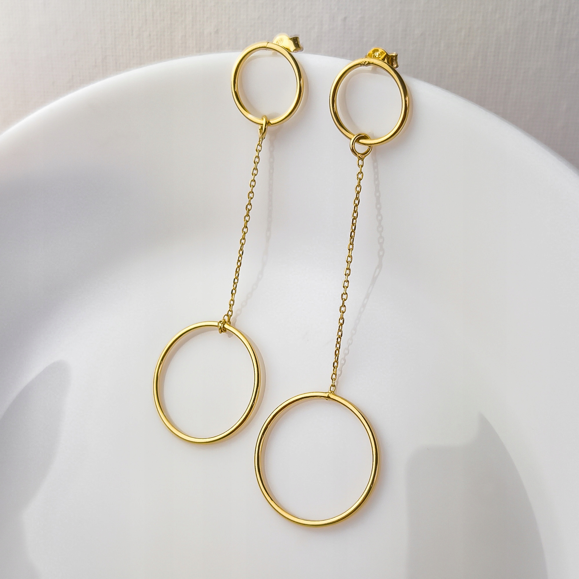 Pozlacené náušnice s závěsným kolečkem pr.925