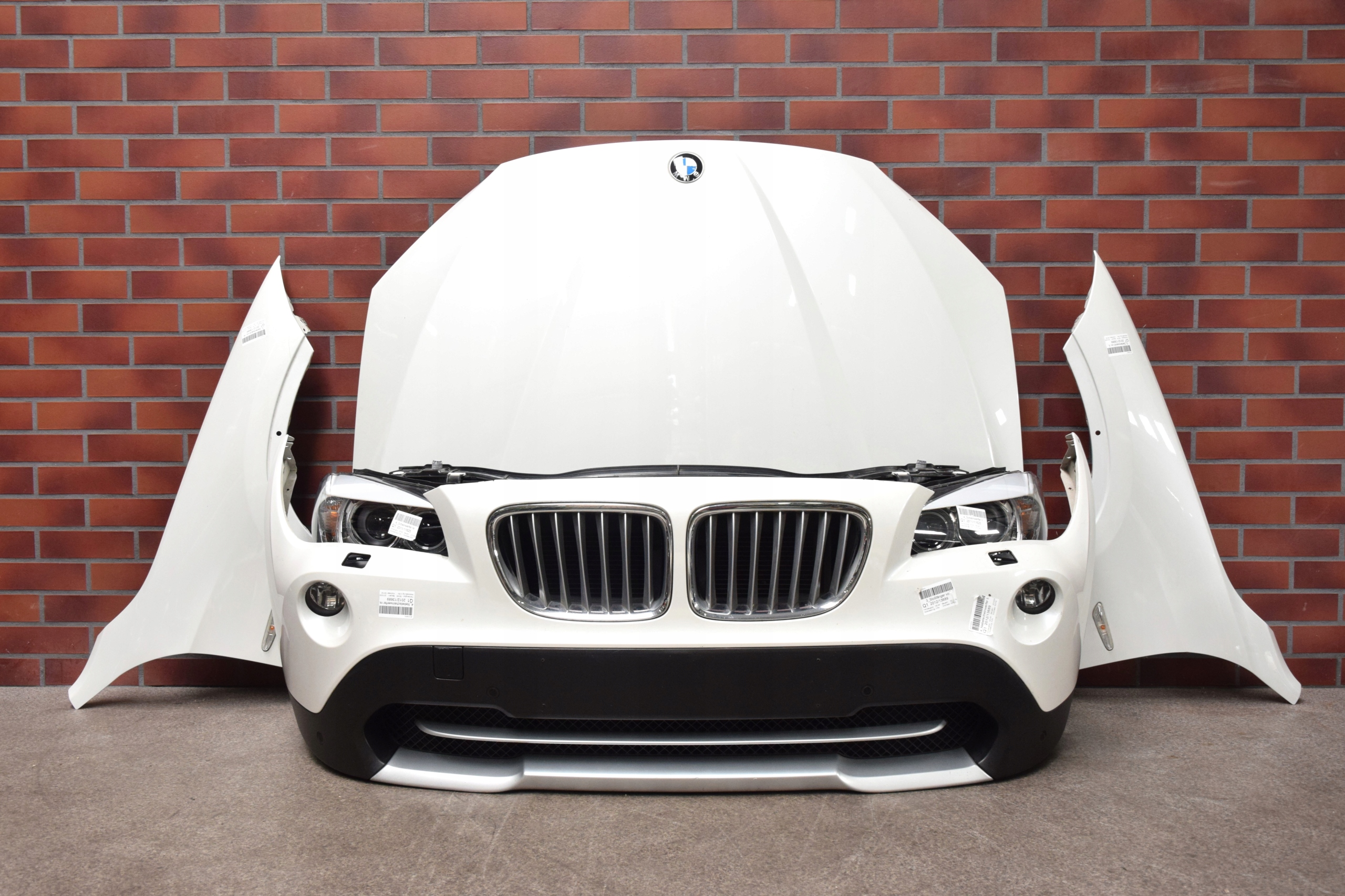 MASKA CHŁODNICE LAMPY XENON ZDERZAK BMW X1 E84