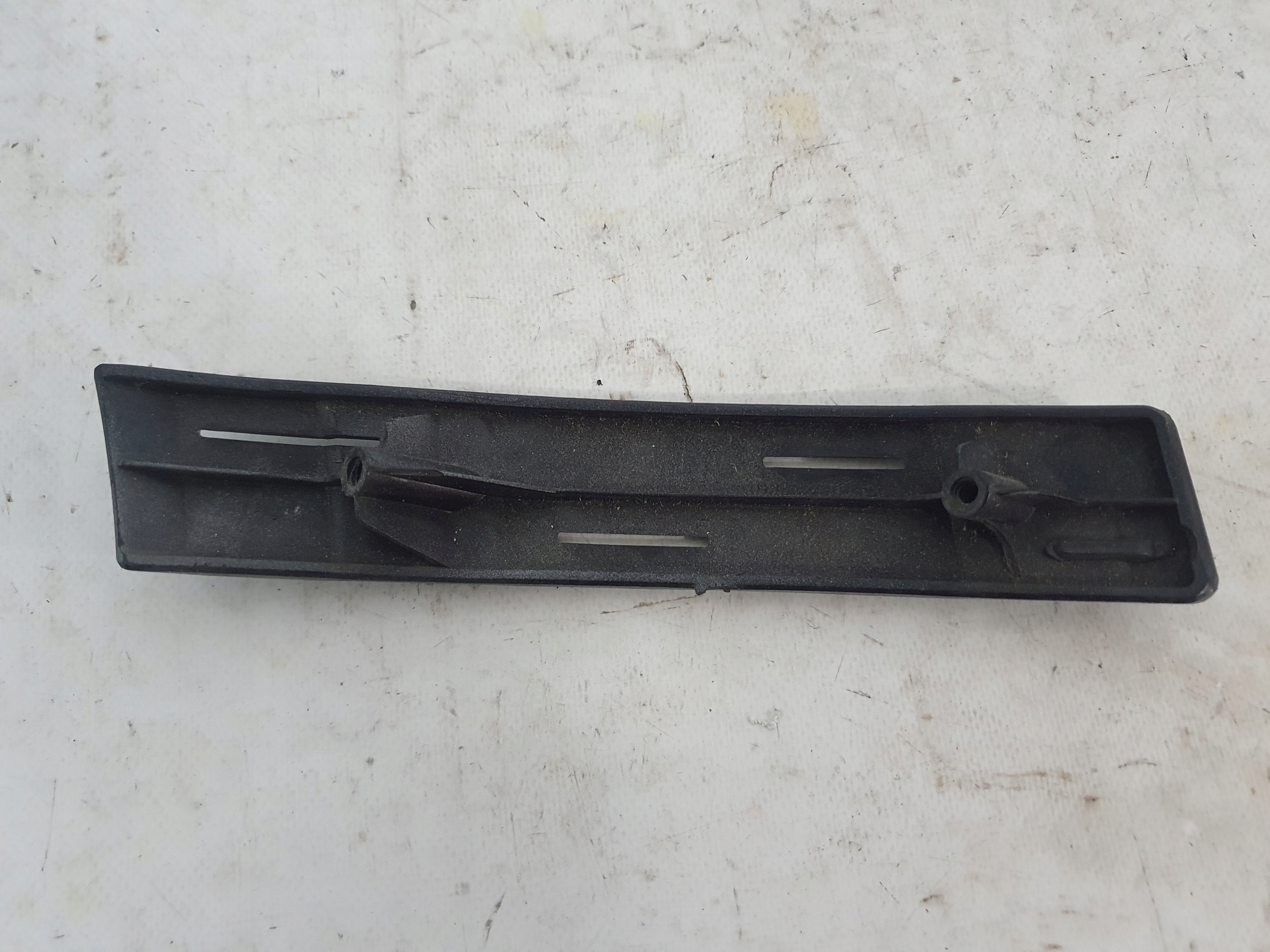 TESLA MODEL S- support holder fog lights of a bumper left front 100312400B