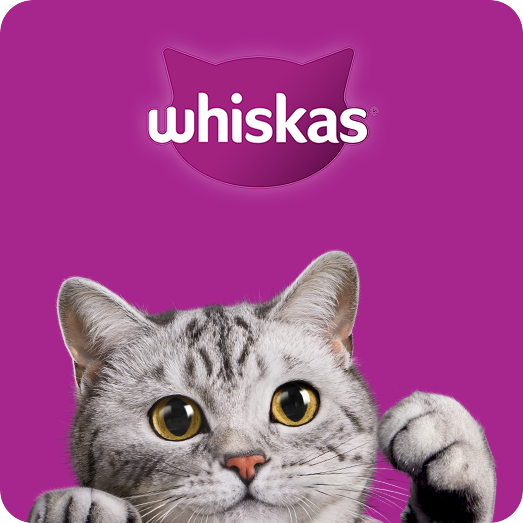 Whiskas cat food logo, purple background, gray tabby cat, paw raised.