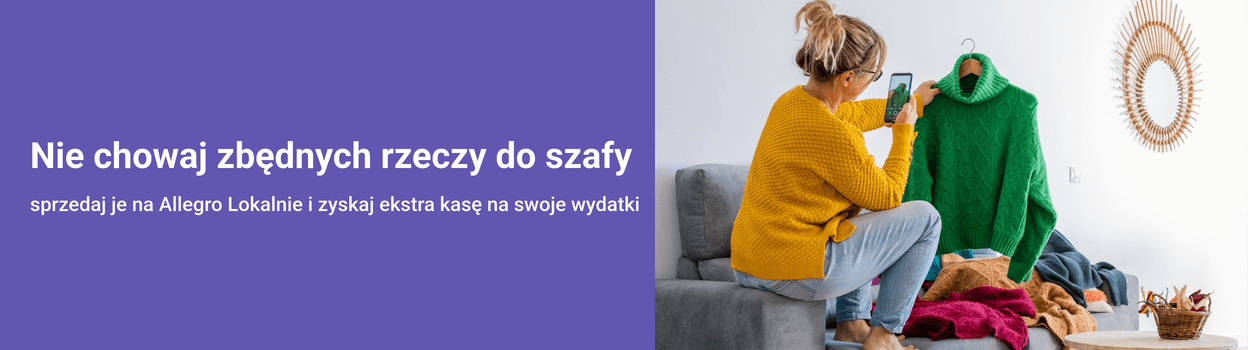 Woman holding a green sweater, plush couch, textured blanket.