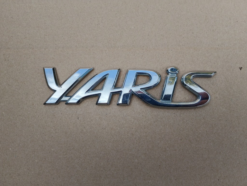 TOYOTA YARIS 3 ЛОГОТИП КРИШКИ БАГАЖНИКА ЗАДНЬОЇ 75442-0D150 