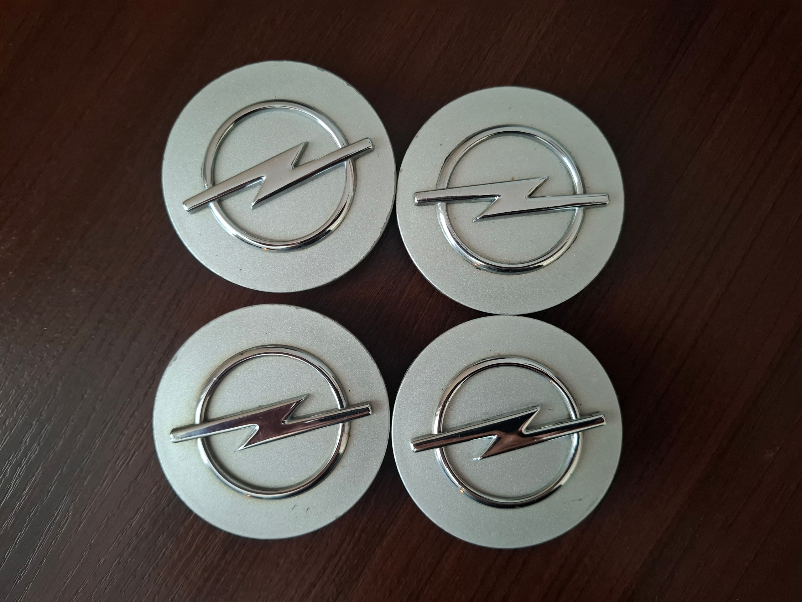 OPEL 4 ОРИГІНАЛ DEKIELEKI DO ДИСКІВ 64MM 