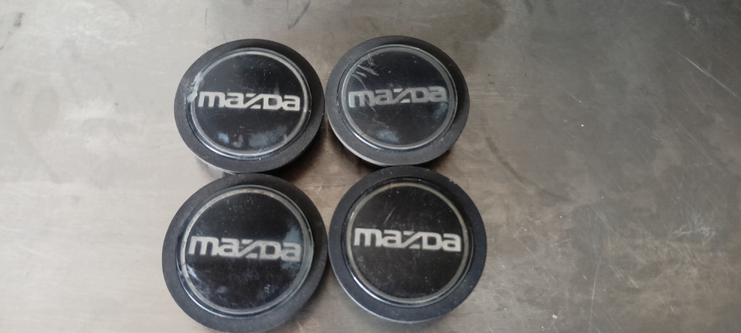 DEKIELKU КОВПАЧКИ KAPSELKI КОЛЕСНІ ДИСКИ ДИСКІВ MAZDA OEM 54 MM #2094 I #2504 