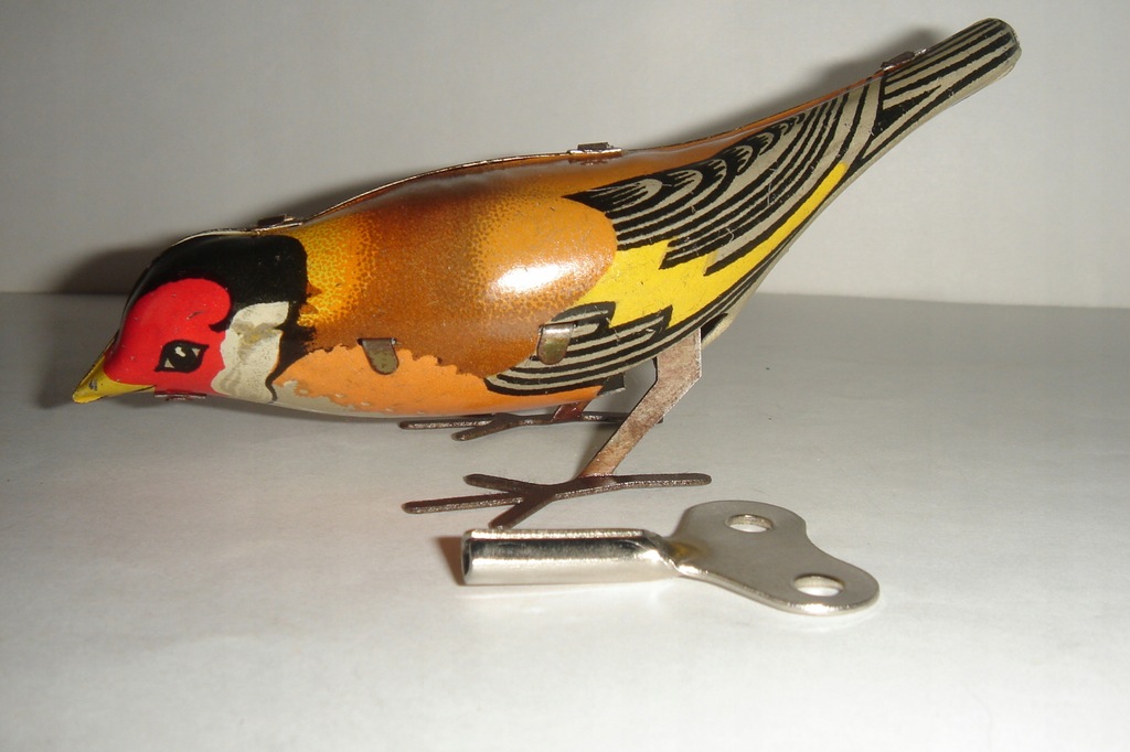 Dziobiący ptaszek - blaszana zabawka na kluczyk