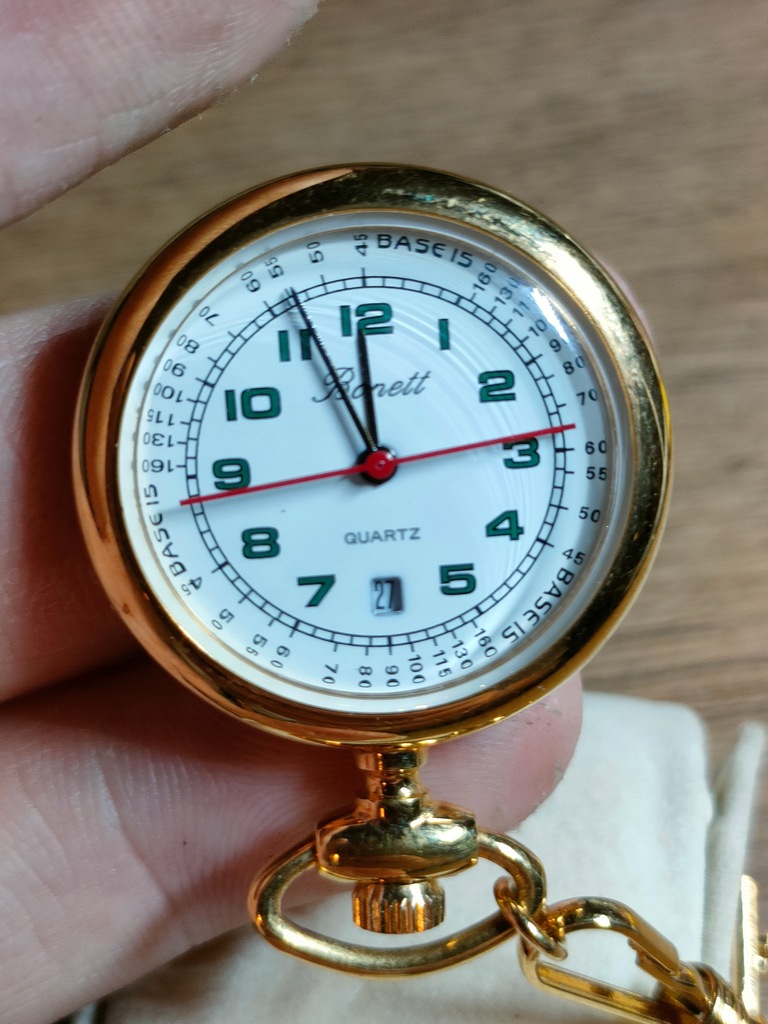 Zegarek typu broszka, złocony Bonett z datownikiem i sekundnikiem