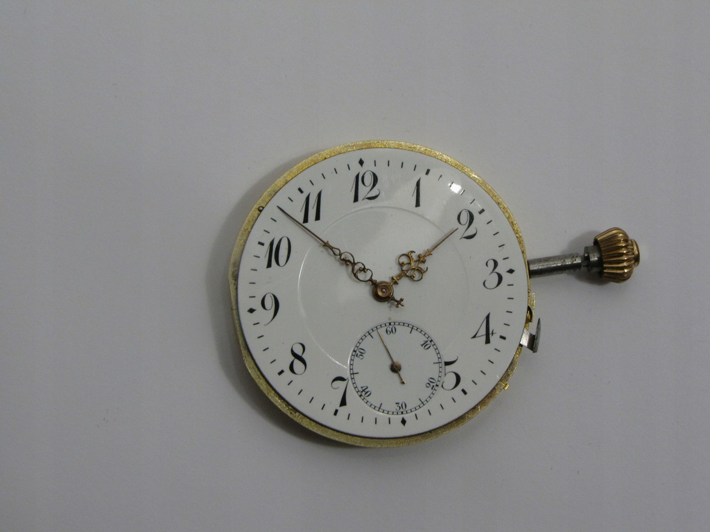 Mechanizm zegarka kieszonkowego ze złotej koperty