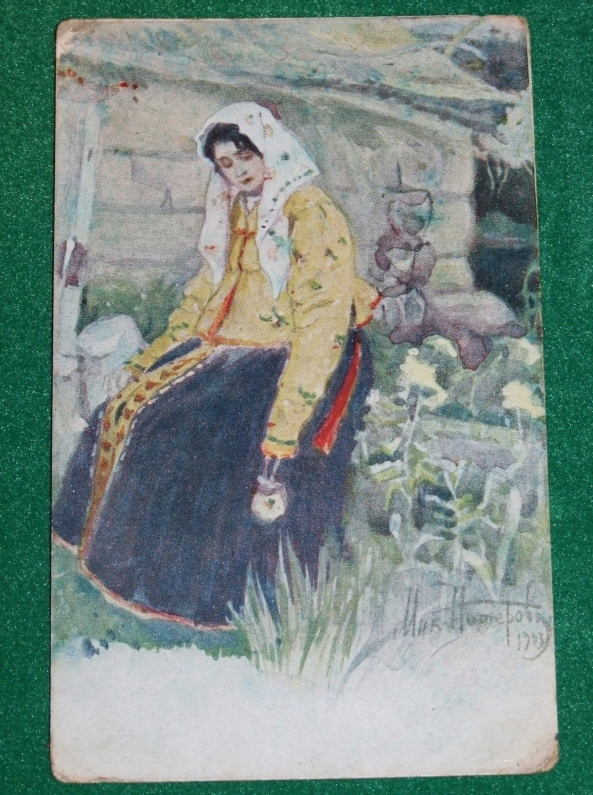 Siedząca kobieta - przedwojenna pocztówka