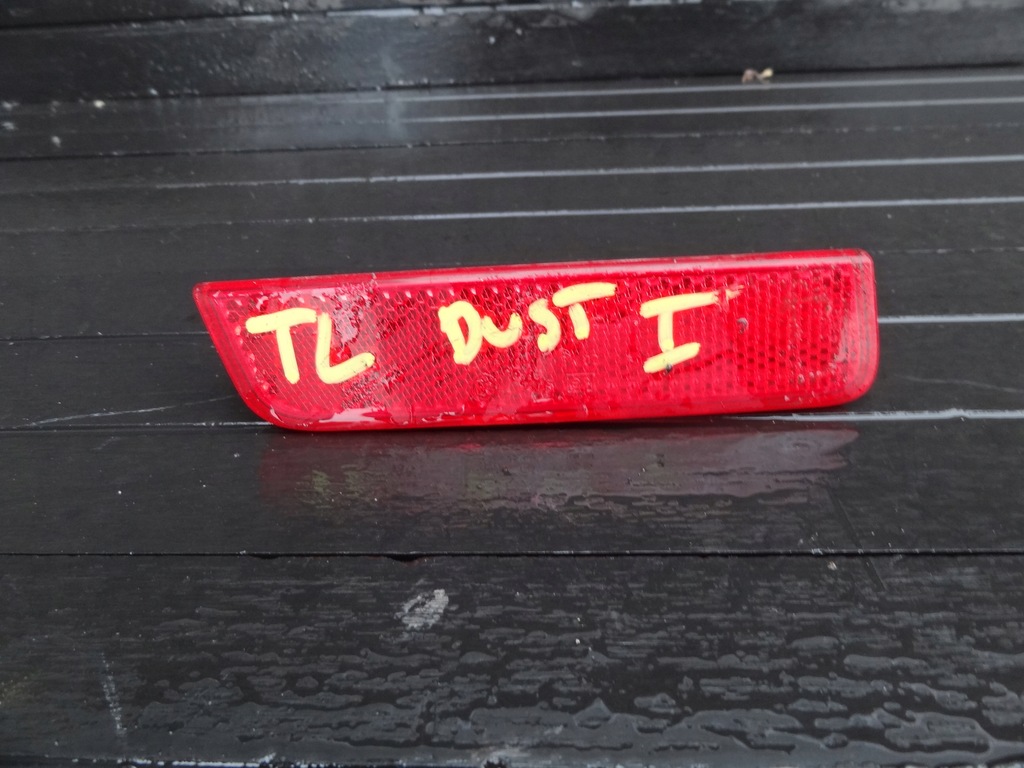 DACIA DUSTER 2011 ODBLASK ZDERZAKA LEWY TYL ORG