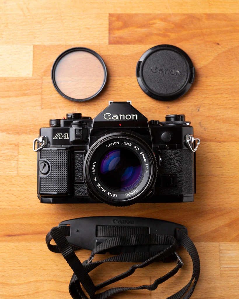 Canon A-1 + NEW FD 50mm 1.4 + Grip + UV +Pasek itp