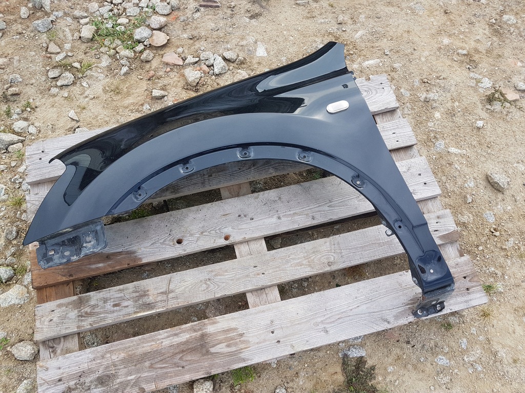 NISSAN QASHQAI I J10 BŁOTNIK LEWY PRZÓD TRIM Z11G 12324447437