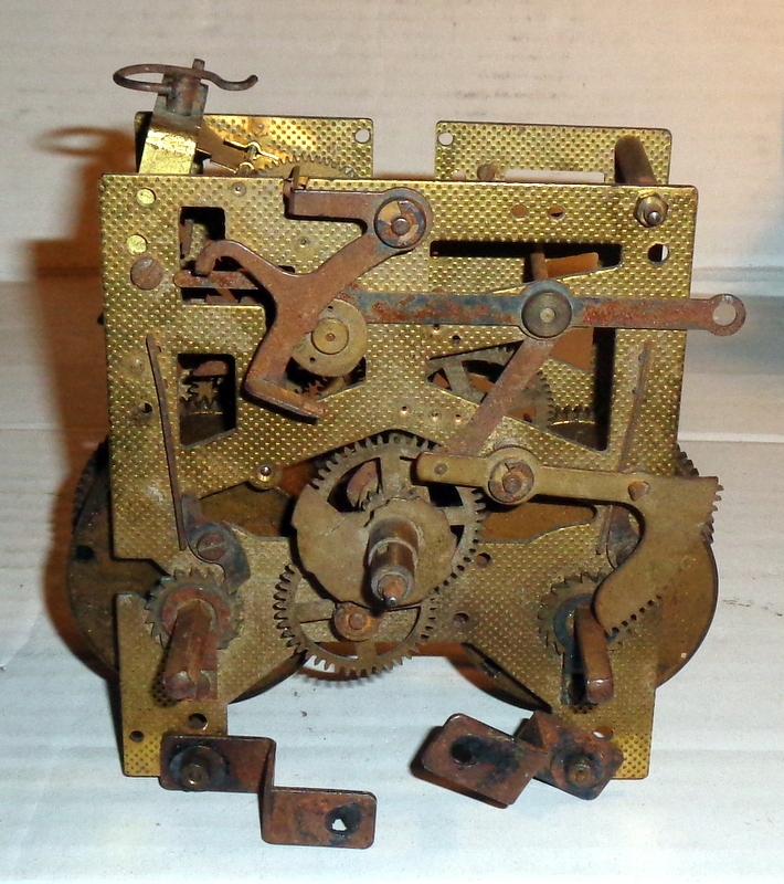 Stary mechanizm zegarowy .