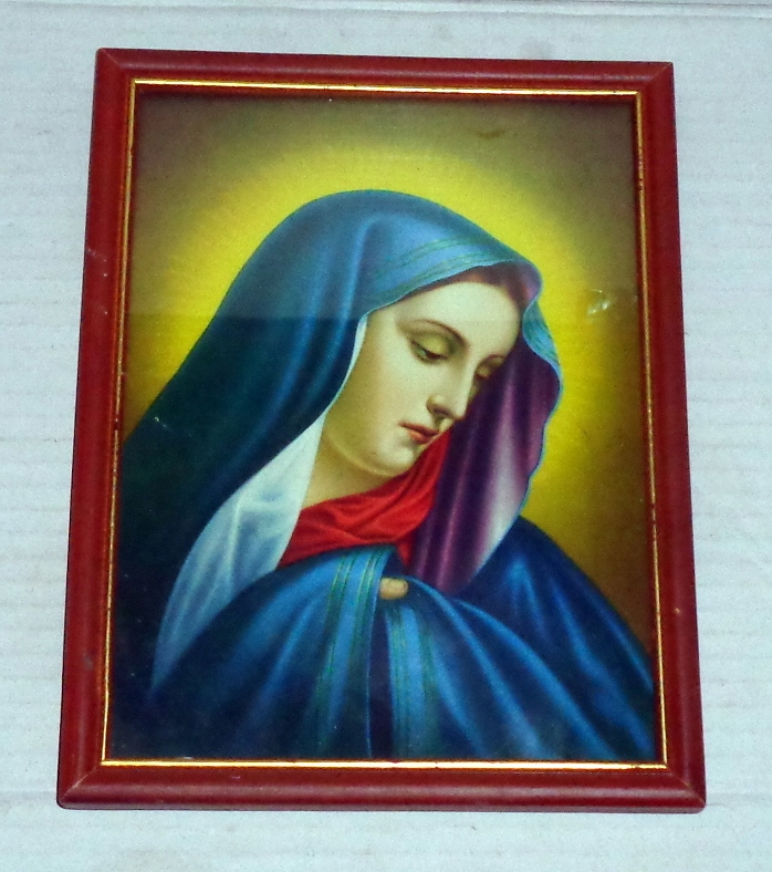 Portret Świętej - obrazek w ramie za szkłem.