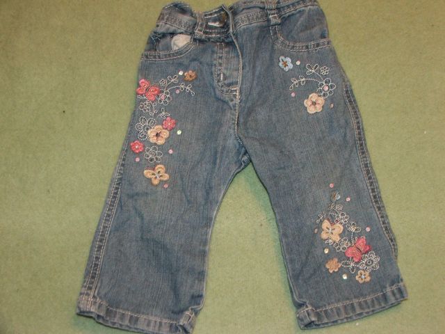 Spodnie z kwiatkami 6-9m Cherokee