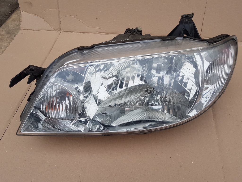 Mazda 323F BJ lift 0103r lampa lewa europa orygin