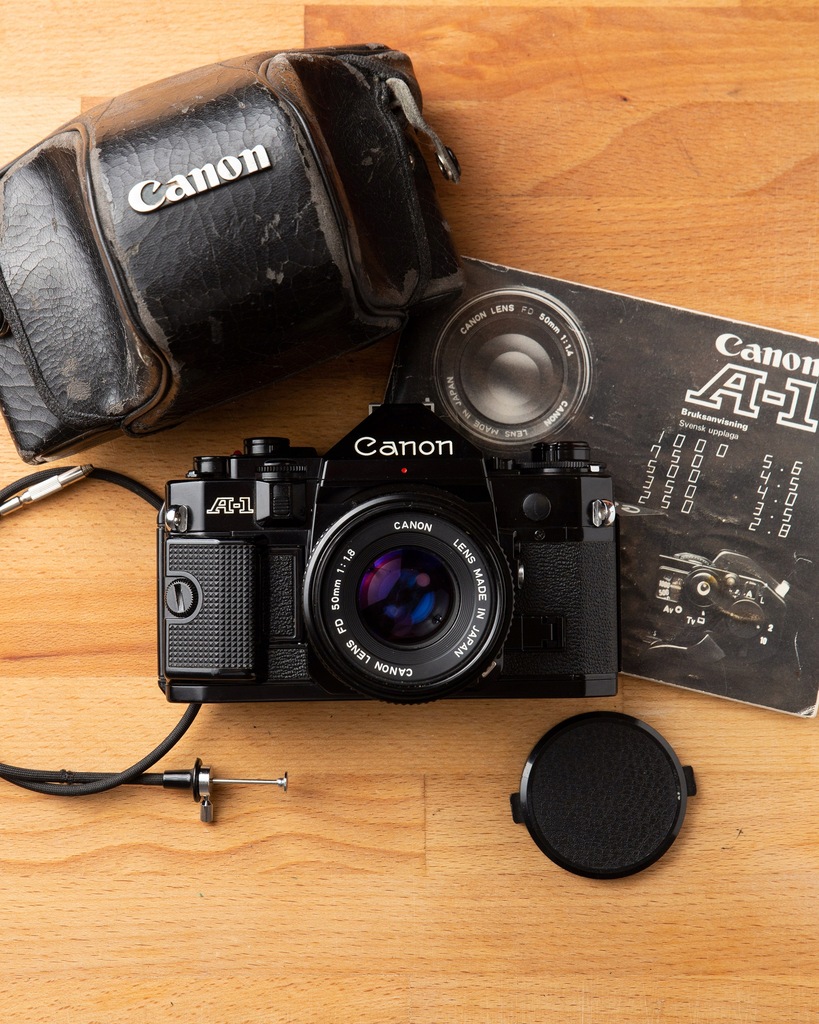 Canon A-1 + New FD 50mm 1.8 +Grip +Etui +Wężyk