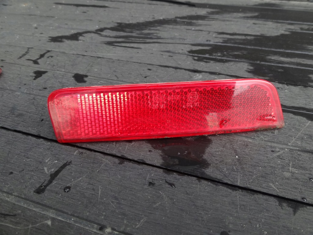 DACIA DUSTER 2012 ODBLASK ZDERZAKA LEWY TYL ORG