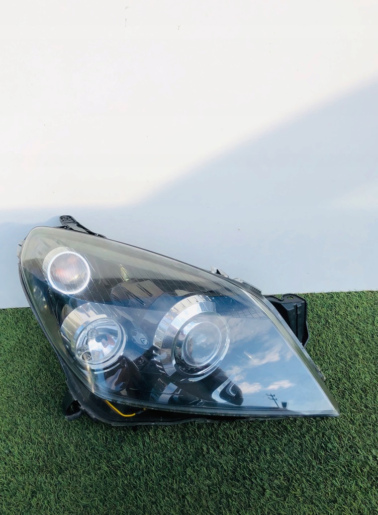 LAMPA OPEL ASTRA H 3 III BIXENON SKRĘTNY AFL EU