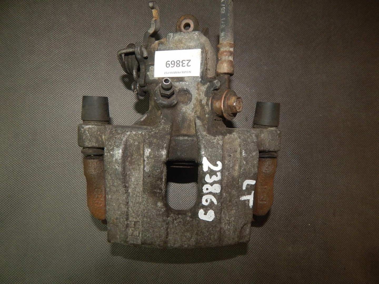 NISSAN PRIMERA caliper brake left rear part