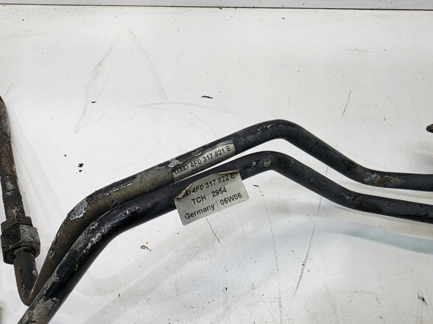 vedení hadice OLEJOWE převodovky AUDI A6 C6 4F0317819E