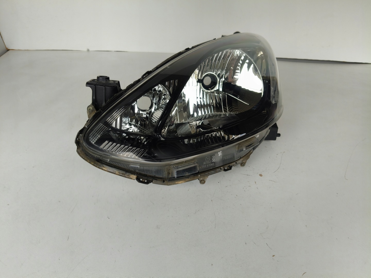 light left REFLEKTOR MAZDA 2 07