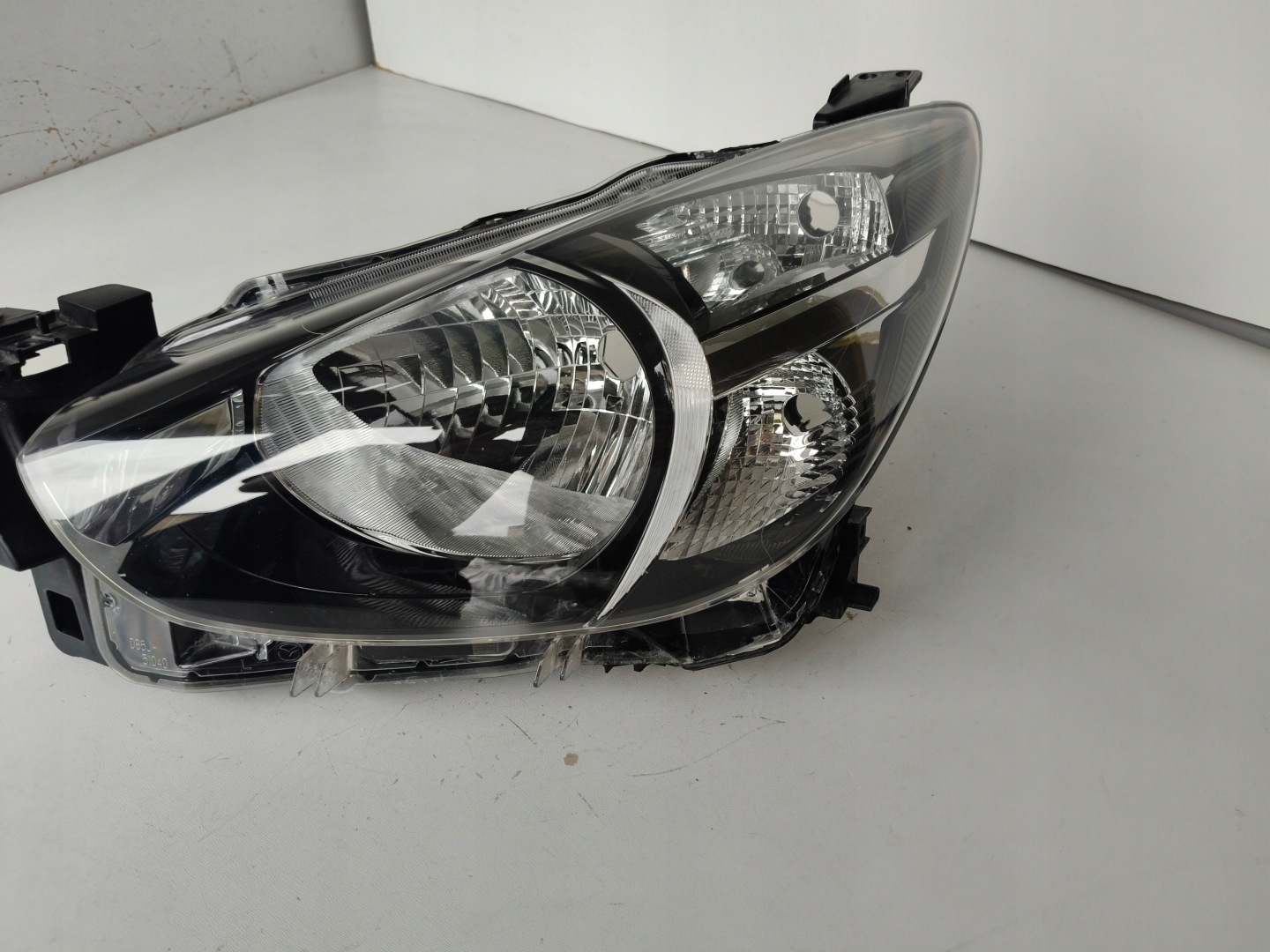 light left REFLEKTOR MAZDA 2 14