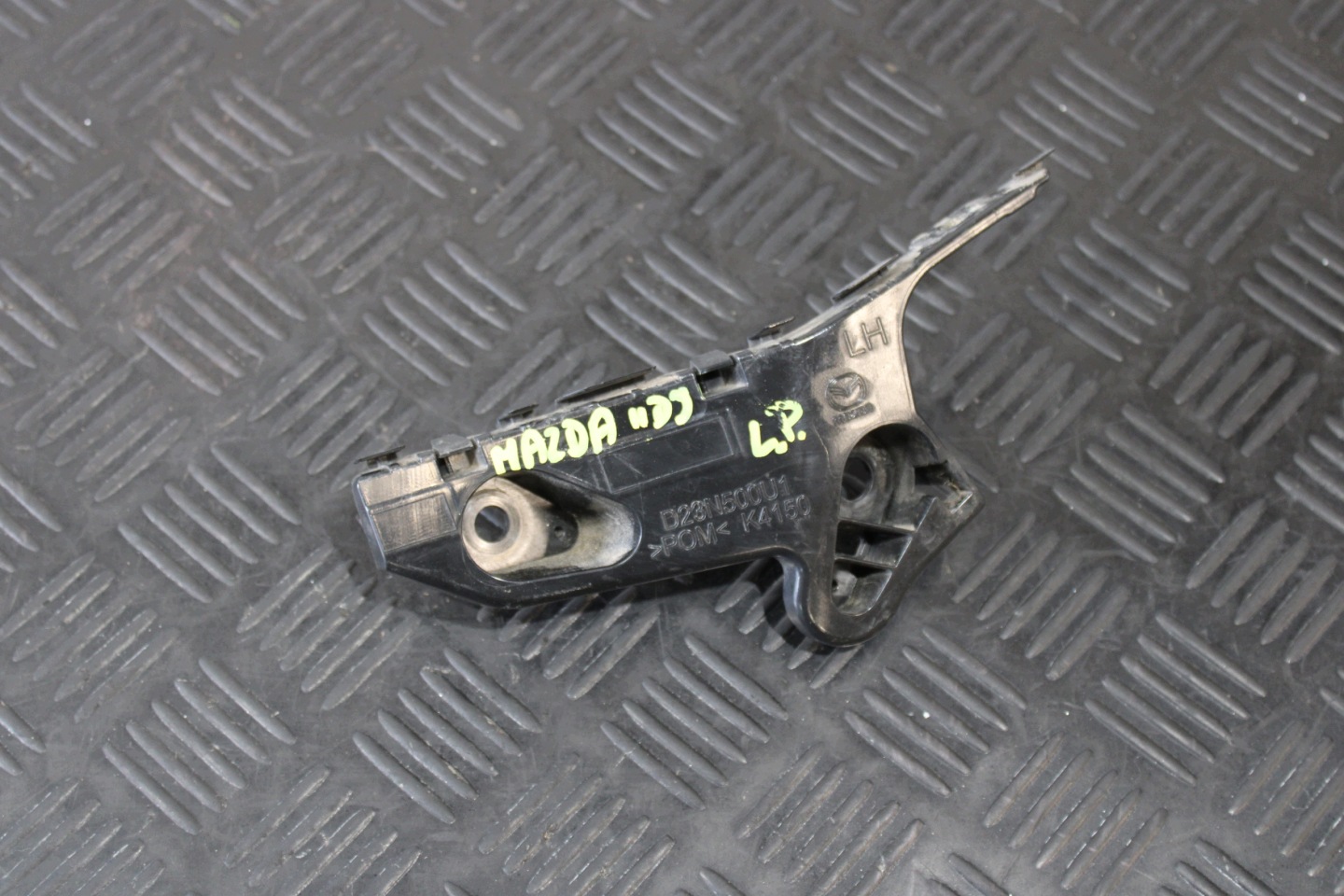 support holder of a bumper left front D23N500U1 MAZDA 2 II DJ LIFT