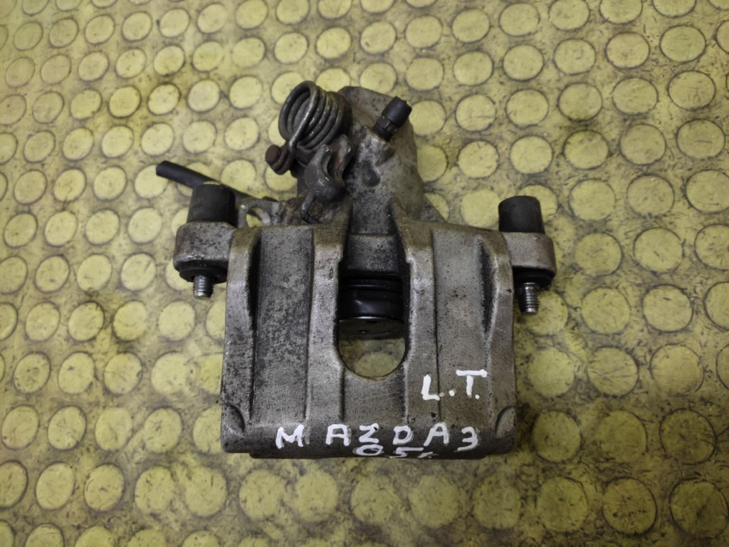 MAZDA 3 třmen brzdový levý záď