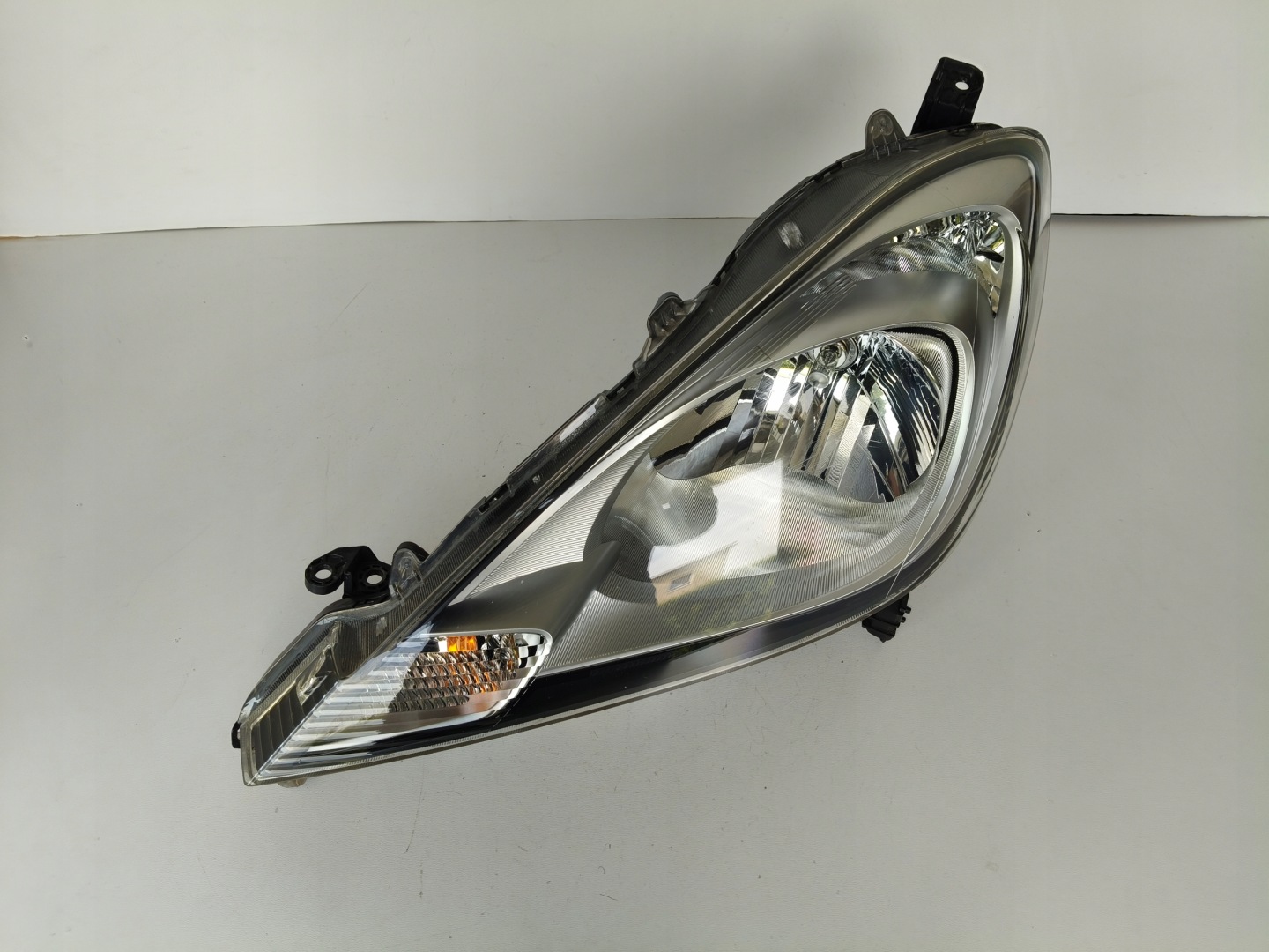 light left REFLEKTOR HONDA JAZZ III 11- LIFT