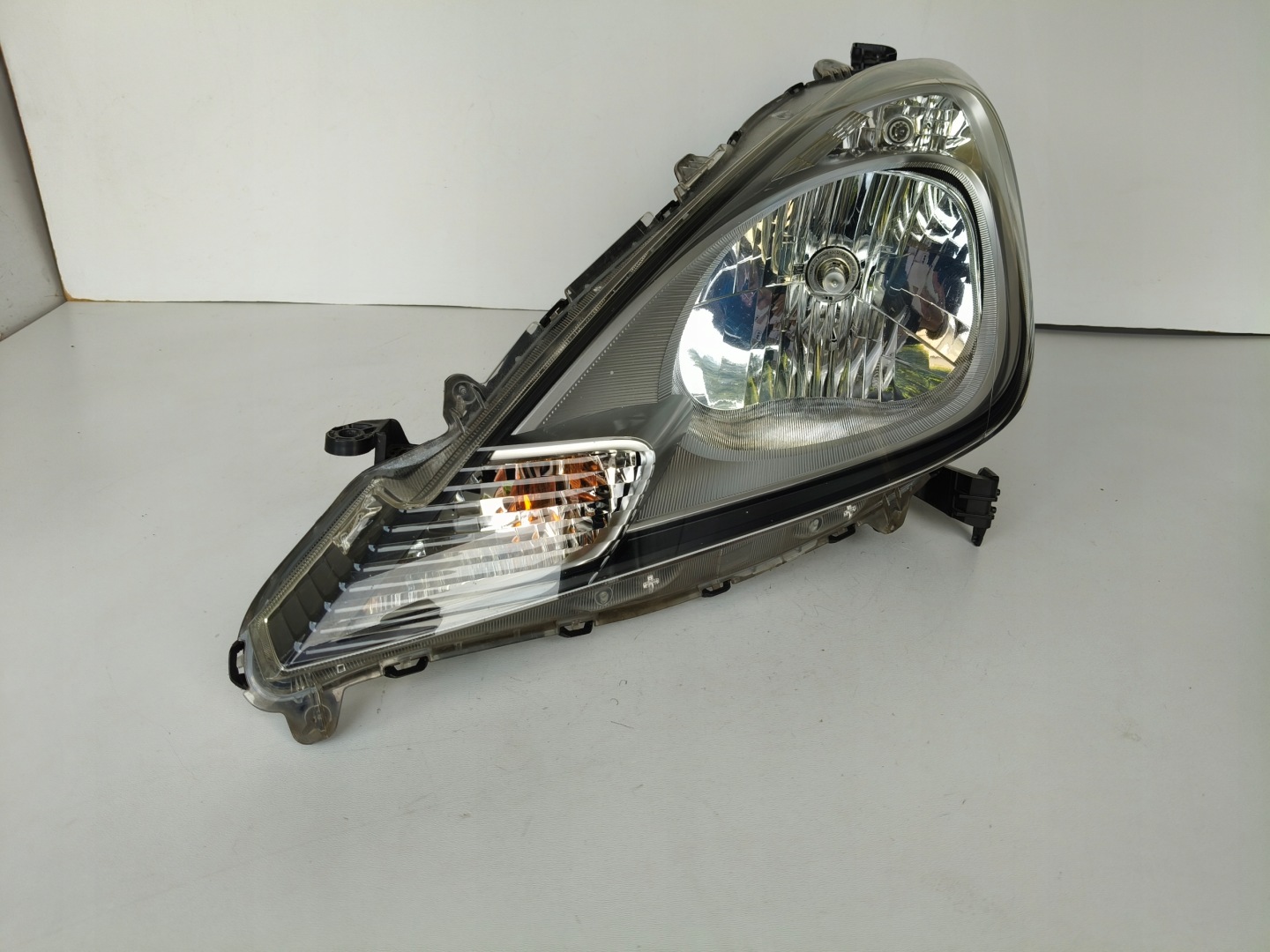 light left REFLEKTOR HONDA JAZZ III 11- LIFT
