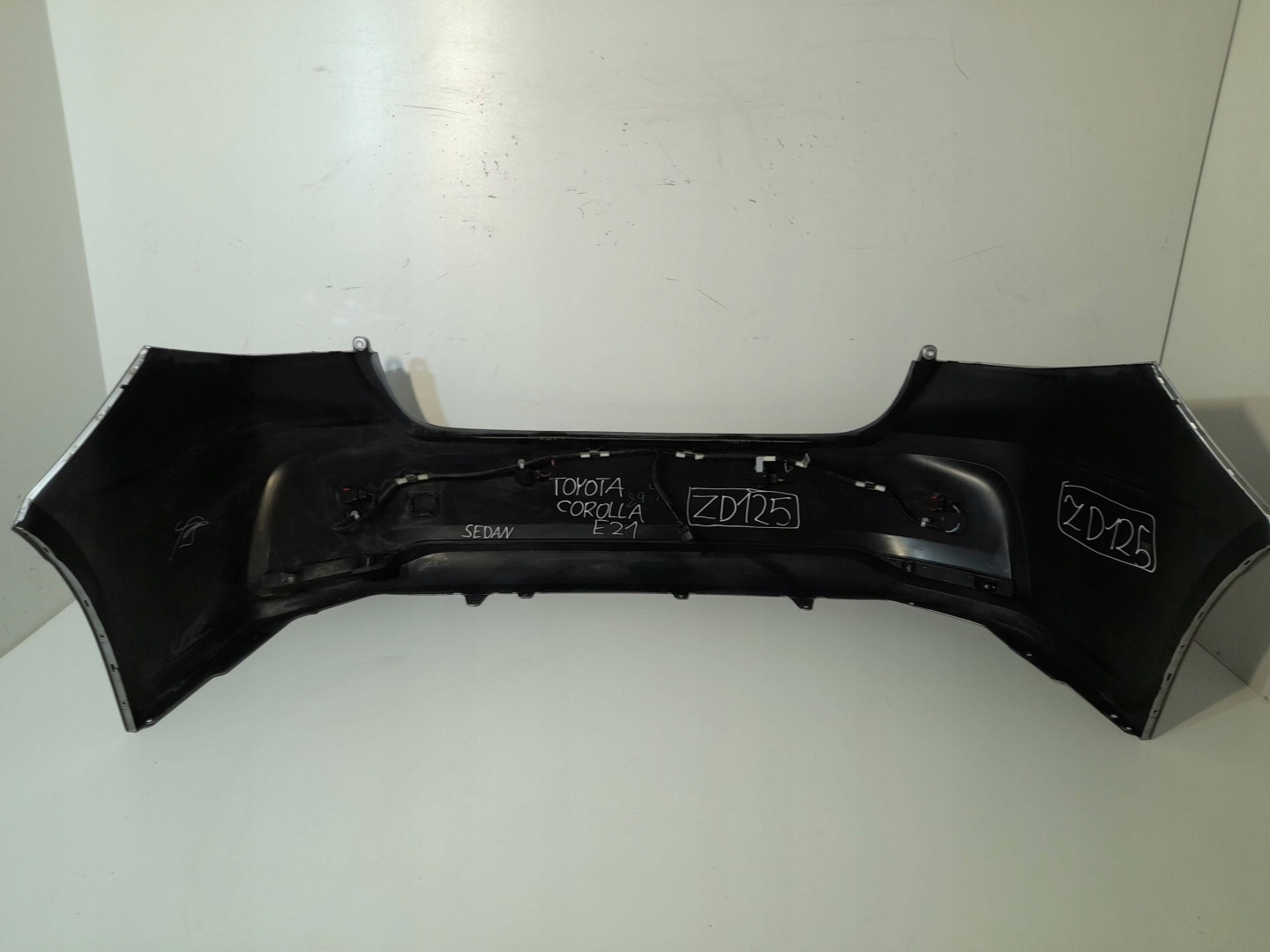 Toyota Corolla E210 E21 bumper rear sedan 4PDC (ZD125)