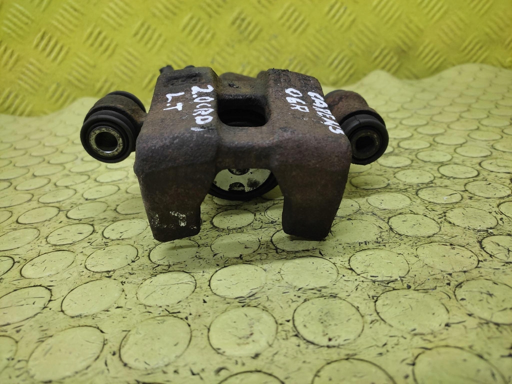 KIA CARENS 2.0 CRDI caliper left rear part