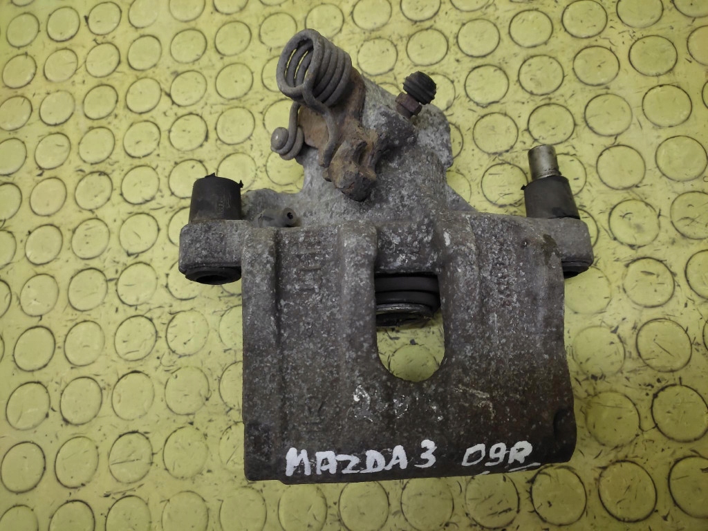 MAZDA 3 caliper left rear part