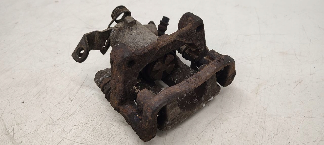 caliper rear part rear left Opel Astra H 1,6 HB