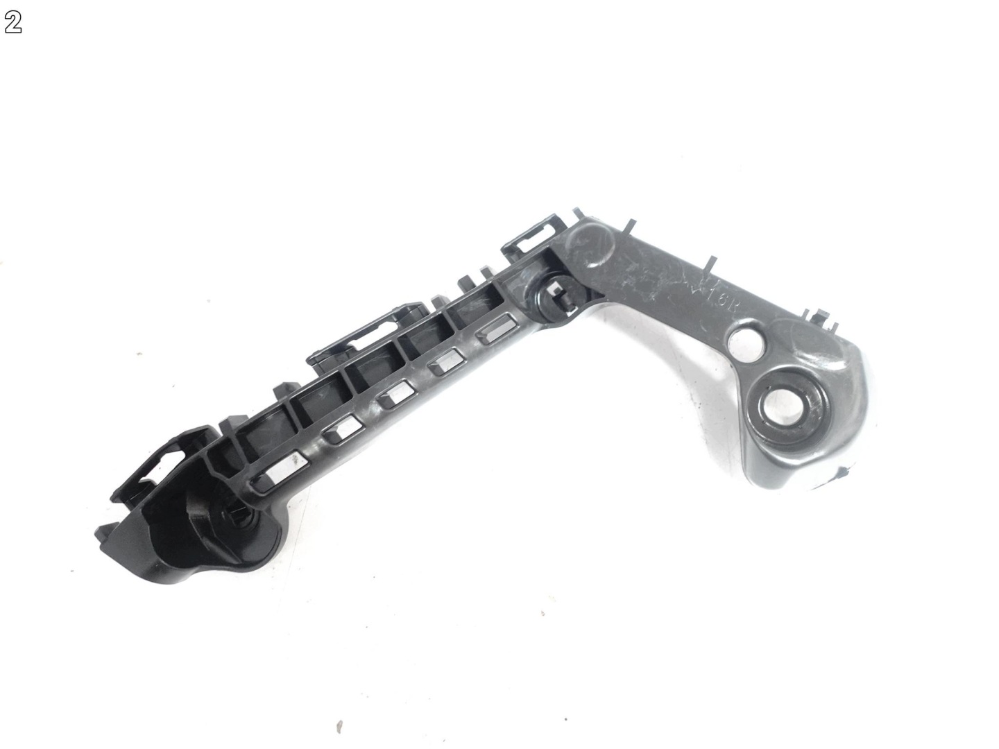 TOYOTA COROLLA E21 XII 18- support holder W bumper front right ORG