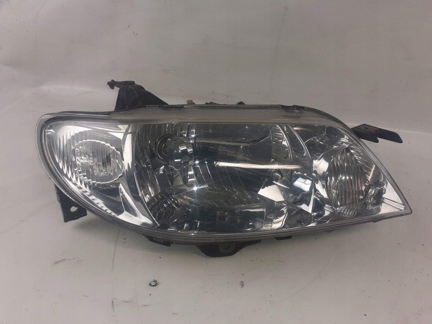 Reflektor front front right Mazda 323