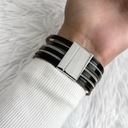 Женский кожаный браслет черного цвета с полосками
