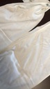 Biele dámske nohavice široké nohavice defekt 38 Dominujúci vzor bez vzoru