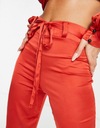 Femme Luxe červené dámske nohavice defekt 38 Veľkosť 38
