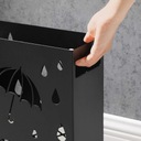 Декоративная подставка для зонтов из черного металла.