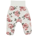 Półśpioszki niemowlęce w kwiaty. Spodnie ze stópkami dla dziewczynki r.68