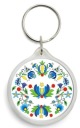 Круглый брелок белого цвета с кашубской вышивкой