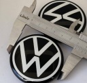 ОРИГІНАЛ КОВПАЧОК КОВПАК КОВПАЧОК ЗАГЛУШКА VW A58 10A601171 60MM CZARNO-BIALE  (1085285439) фото min 1