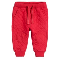 Cool Club Spodnie dresowe chłopięce pikowane czerwone r 80