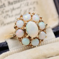 Złoty pierścionek z opalami piękny kwiatek 9K